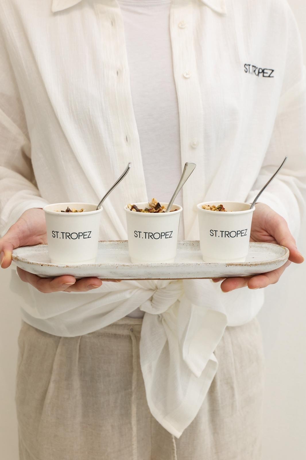 ST.TROPEZ branded cups on serving tray